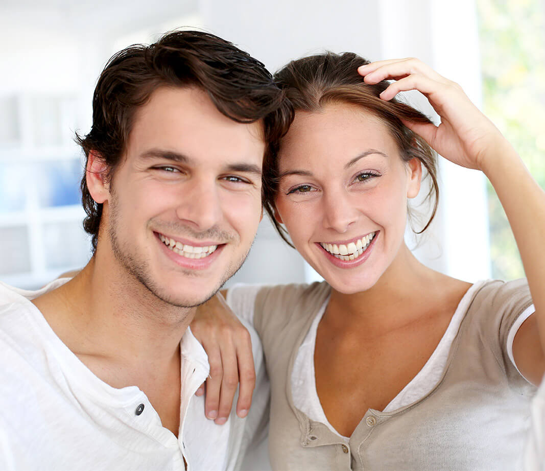 Young male and female couple smiling