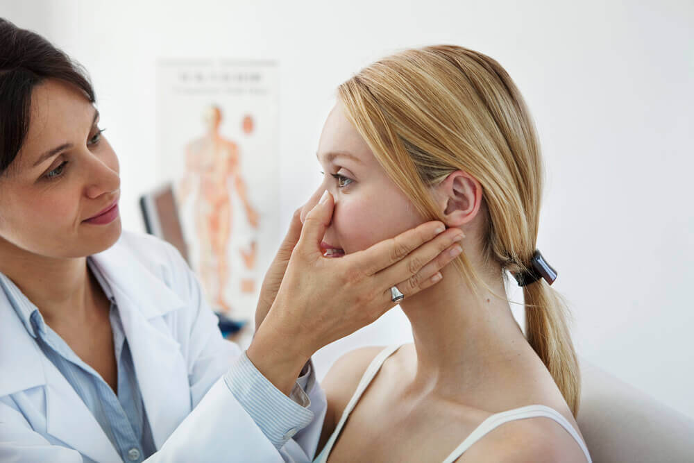 Aesthetician specialist checking her patients nose