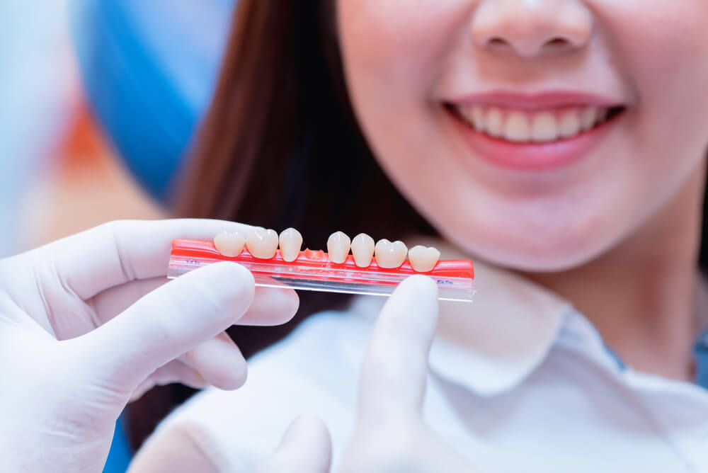 Dentist With Tooth Implant False Teeth