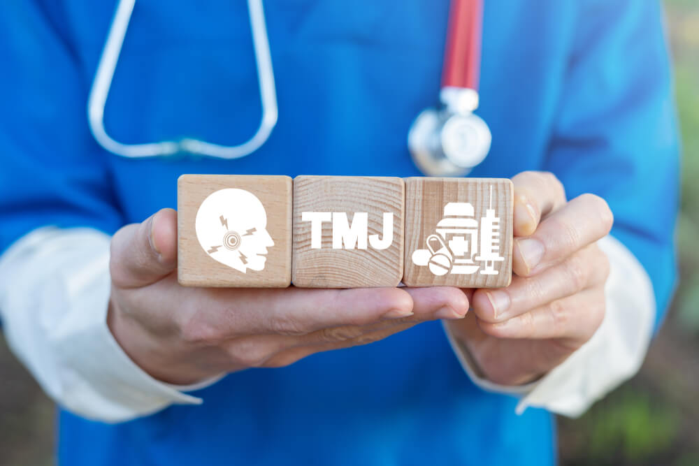 Tmj Tmd Health Care Concept on Wooden Blocks in Doctor Hands